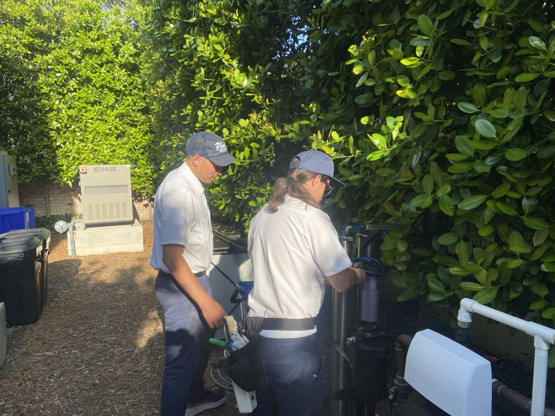 Crew inspecting purified water filtration system