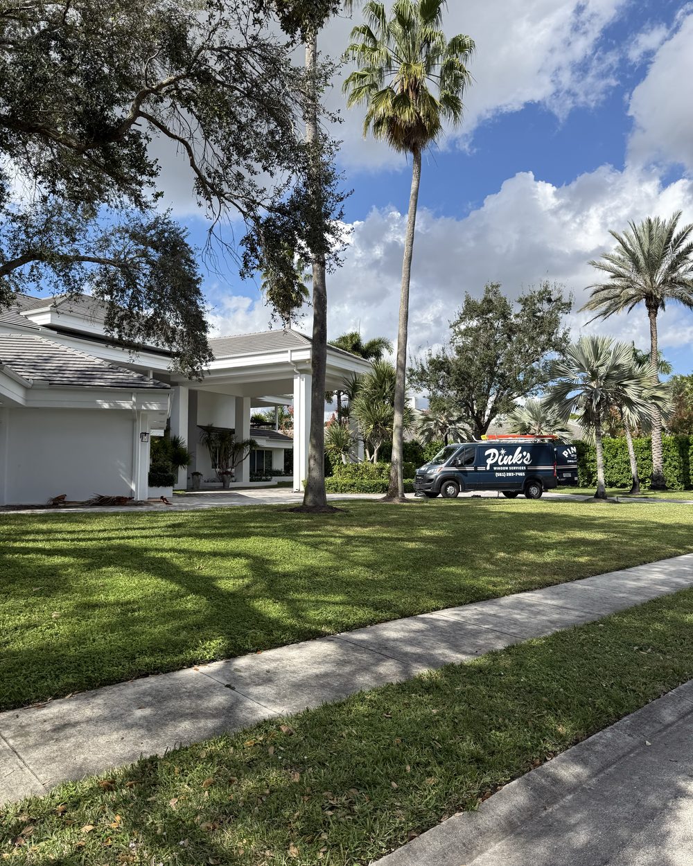 Pink's Window Services van at a Palm Beach estate