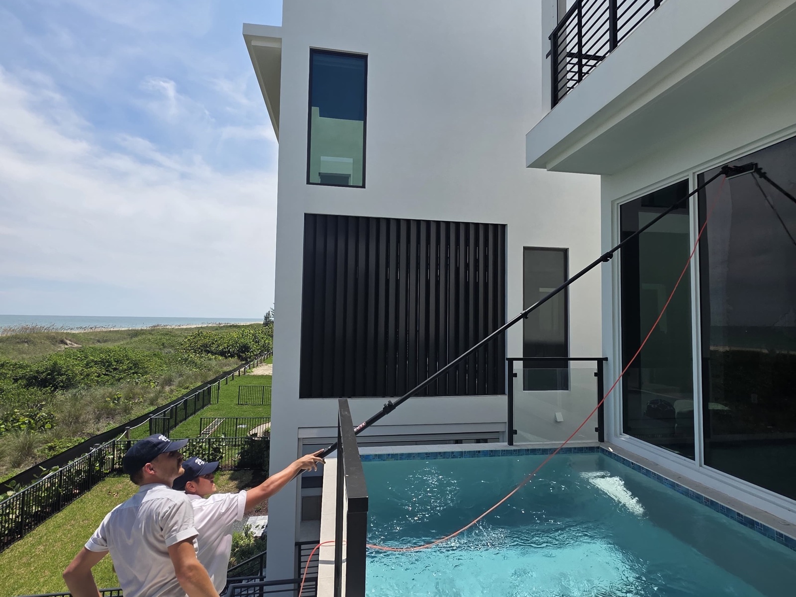 Water-fed pole work on an oceanfront Palm Beach home